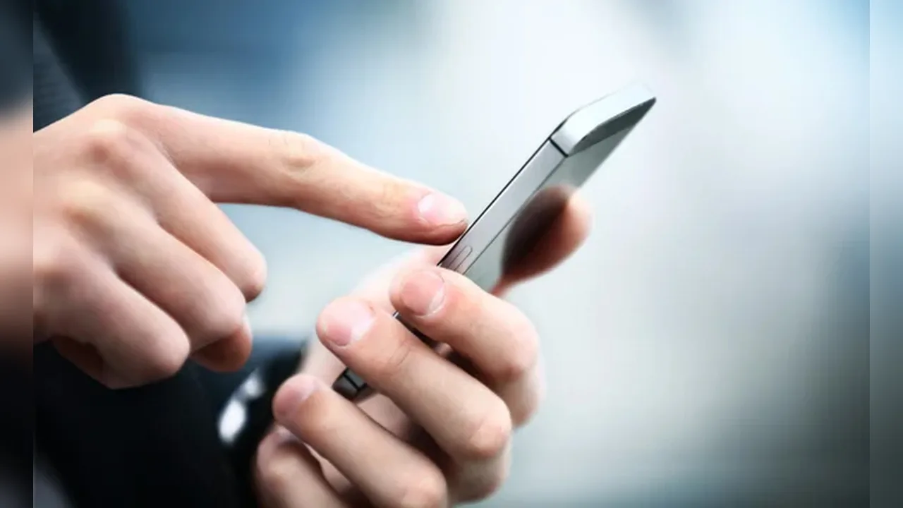 Hands holding and tapping a smartphone